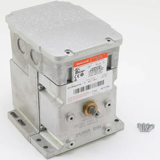 Angled side perspective studio shot of a Honeywell M7284A1004 Modutrol IV actuator motor, cleanly displaying its grey die-cast aluminum housing, upright top wire junction connection compartment, side foot mounting base plates, and the protruding square dual-ended 3/8 inch mechanical control shaft.