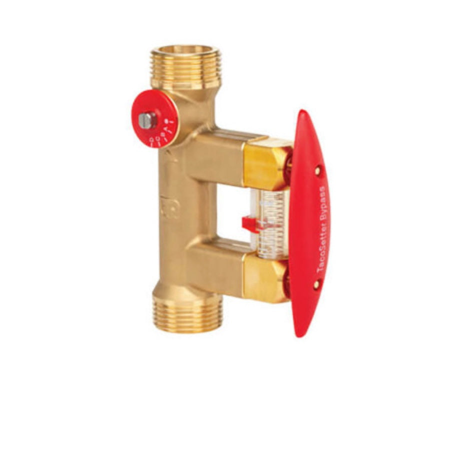 Front perspective studio shot of a Taco 7205-3 TacoSetter Bypass 1 inch union brass balancing valve, highlighting its metallic flow adjusting block, external bypass lever clip, and clean clear cylindrical flow rate indicator sight glass over a stark white background.