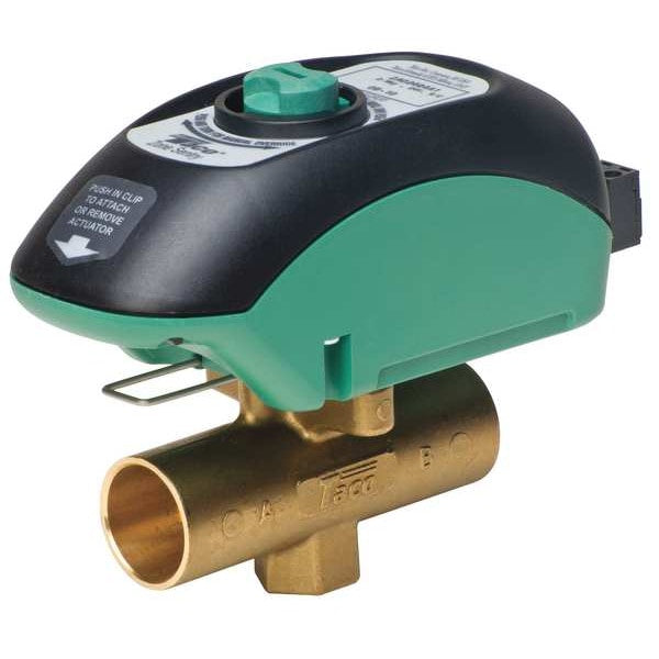 Taco 1-1/4 inch flanged Zone Sentry motorized zone control valve featuring the signature black and green composite low-amperage actuator cover block attached to a heavy forged brass inline ball body.