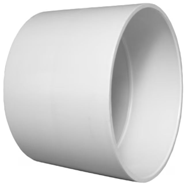 White unthreaded PVC DWV straight coupling sleeve connector showing distinct molded middle ridge pipeline depth stop